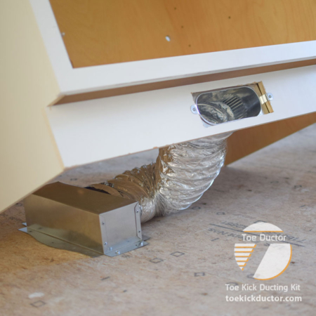 Toe Ductor Floor Vent Kit installed in cabinet toe kick